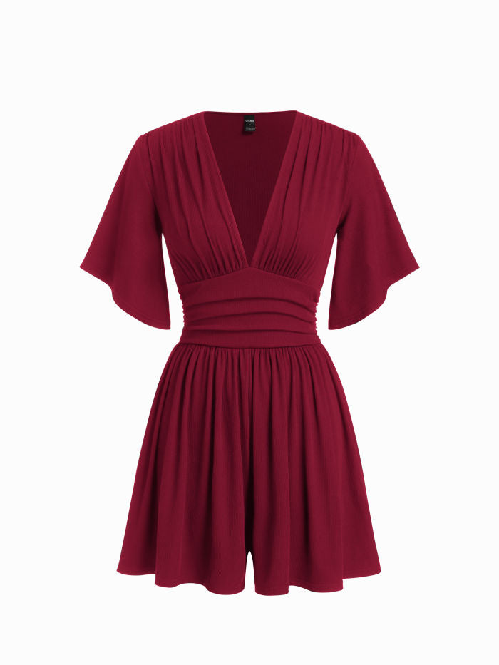 Robe noire élégante à col en V et manches évasées