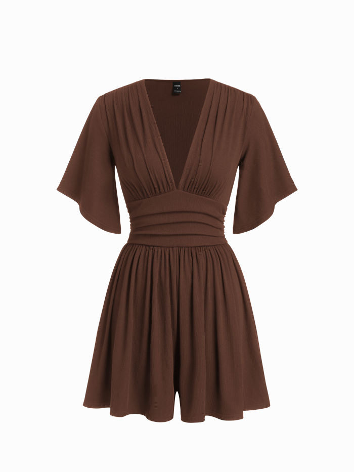 Robe noire élégante à col en V et manches évasées